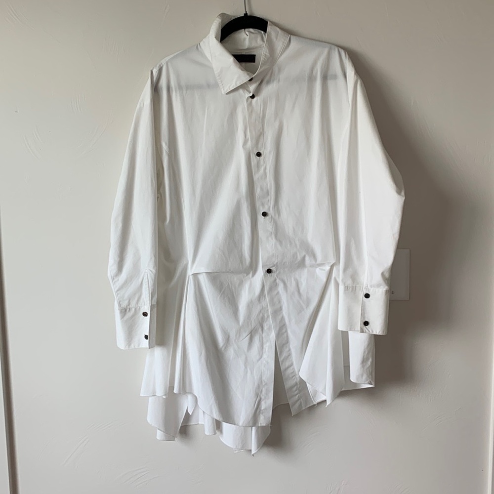 Moyuru asymmetrical white blouse with beautiful draped back and side panels.